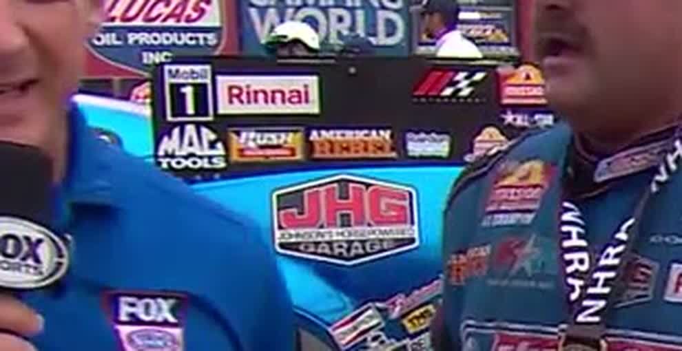 Close crop of the sponsor panel behind Hagan, beside American Rebel