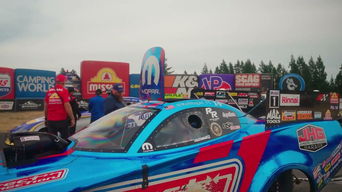 NHRA behind the scenes frame of Hagan's Funny Car in the lanes