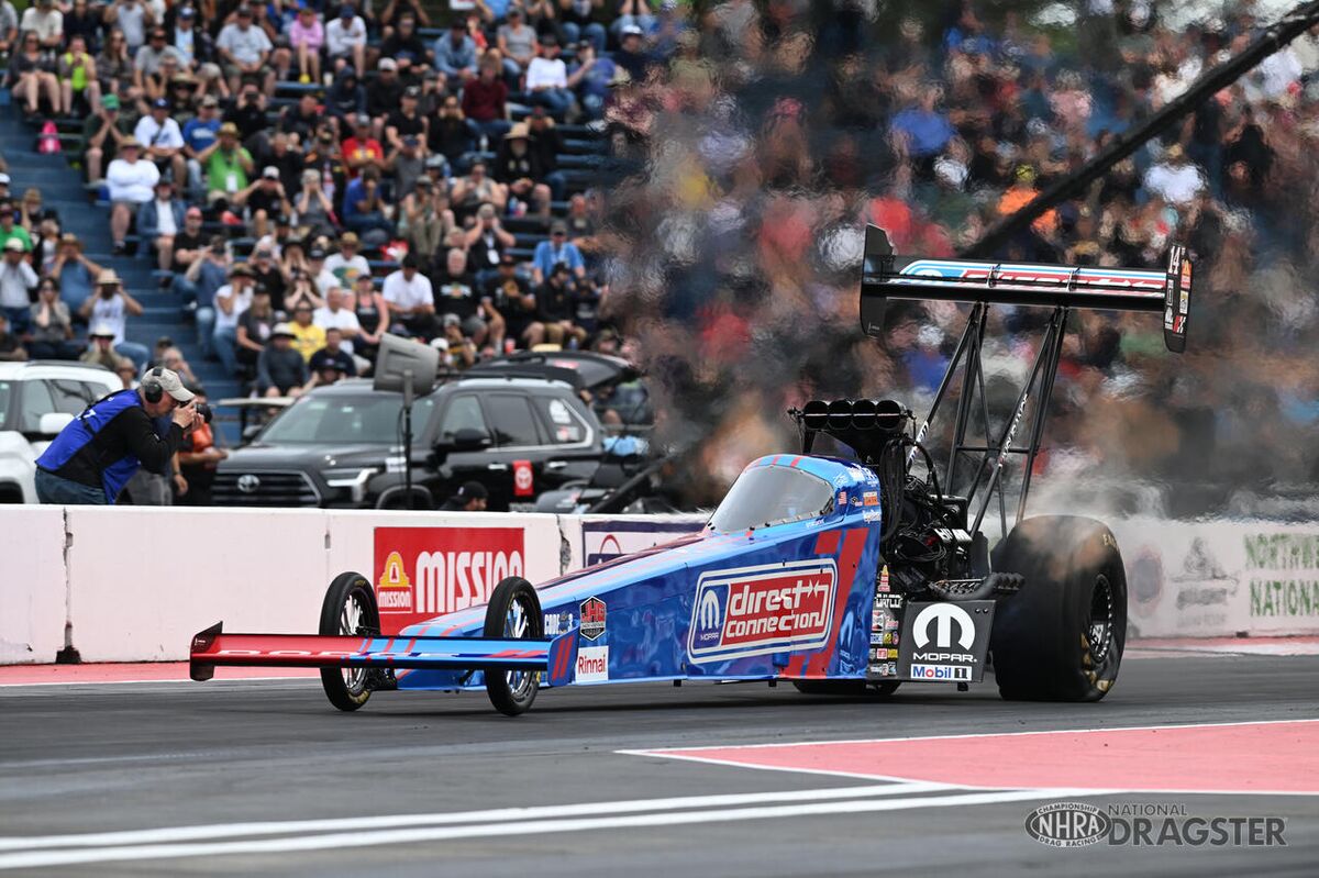 Tony Stewart's Direct Connection Top Fuel dragster on track
