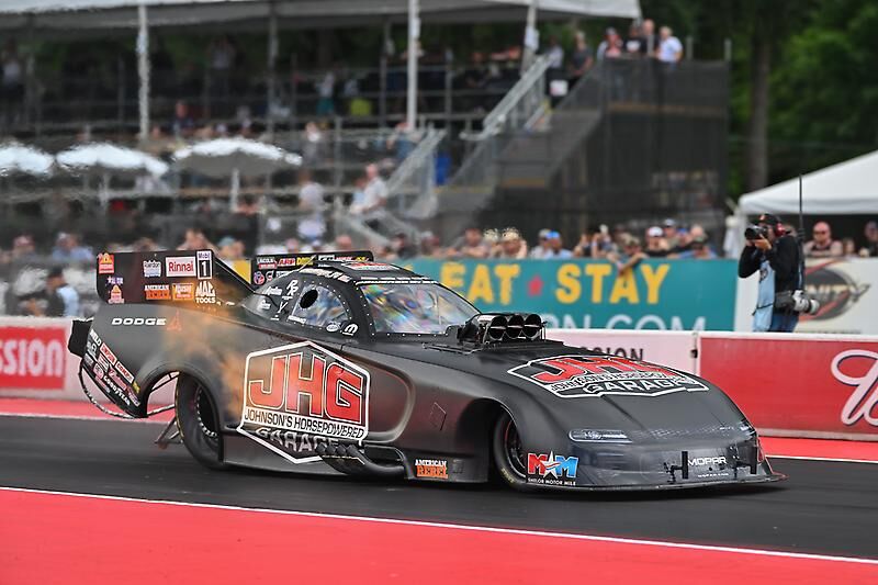 Matt Hagan's black Johnson's Horsepowered Garage Funny Car on track